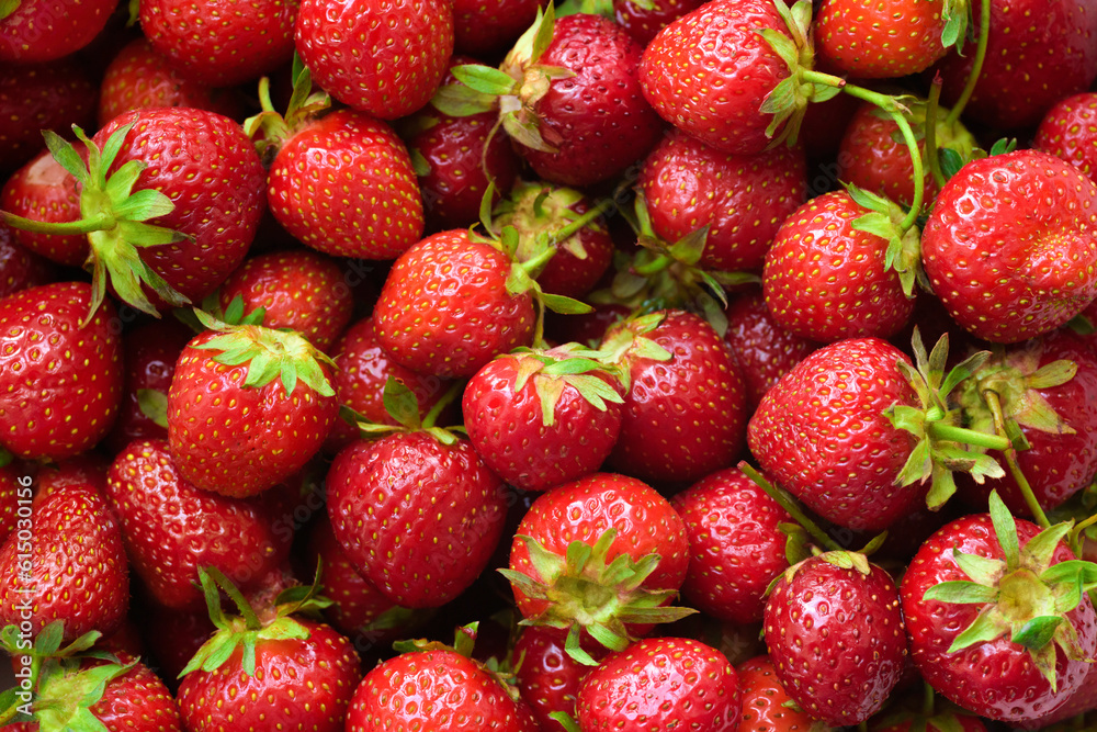 Background of fresh ripe strawberries with green leaves. Background of fresh ripe strawberries with green leaves.