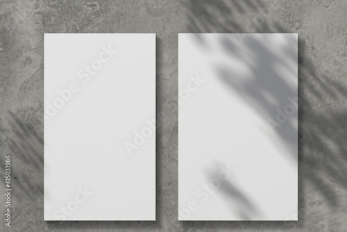 Gray background of concrete texture of cement, white cards of A4, A6 paper, business cards and flyers for the company, beauty sphere. Soft background, shadows from plants, palms. Generative AI