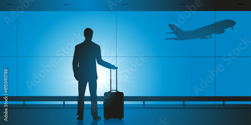 Concept du voyage d’affaires, avec un homme seul qui attend seul à l’aéroport avant d’embarquer dans un avion. photo