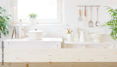 Blurred modern kitchen furniture interior with wooden table in front