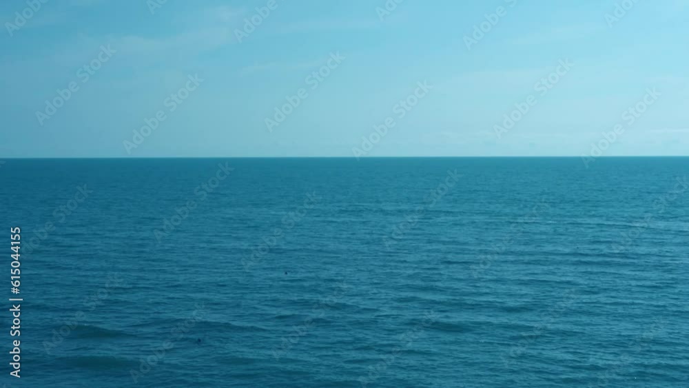 Fast Time Lapse Blue Sea with Small Waves and Clear Blue Sky with Light Cirrus White Clouds. Boat, Calm Ocean, Blue Sky White Feathery Clouds, Beautiful Background 4K. Seascape. Holiday, Travel. Fast Time Lapse Blue Sea with Small Waves and Clear Blue Sky with Light Cirrus White Clouds. Boat, Calm Ocean, Blue Sky White Feathery Clouds, Beautiful Background 4K. Seascape. Holiday, Travel.