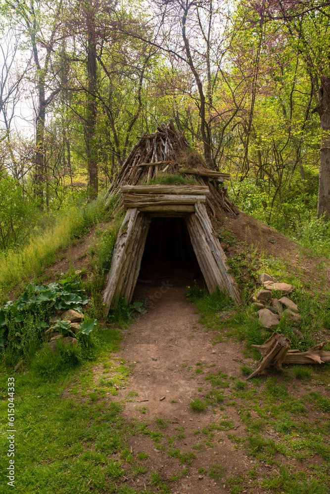 Rustic solitary hut made of wooden timbers and green sod exterior. Rustic solitary hut made of wooden timbers and green sod exterior.