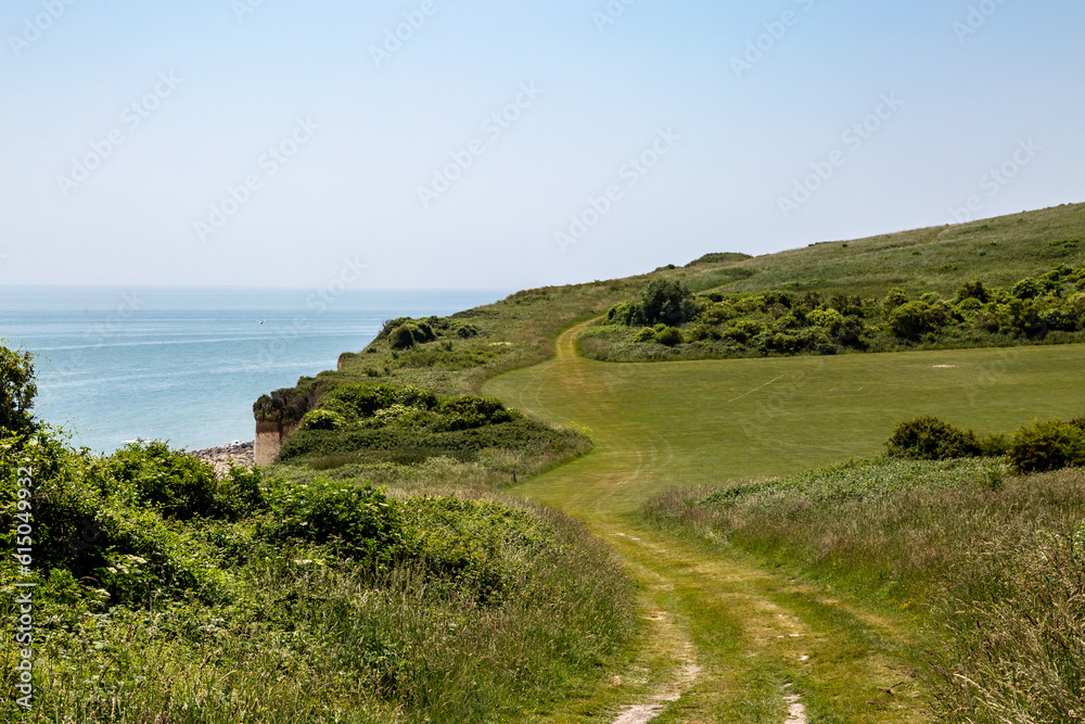 Looking along the path on the cliffs above the beach, leading from Eastbourne towards Beachy Head in Sussex