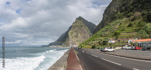 Panoramic view of São Vicente village, a small touristic coast village, main avenue facing the sea and typical tall mountains, on Madeira Island, Portugal photo