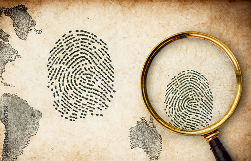 detective investigation scene with old paper, magnifier and fingerprint