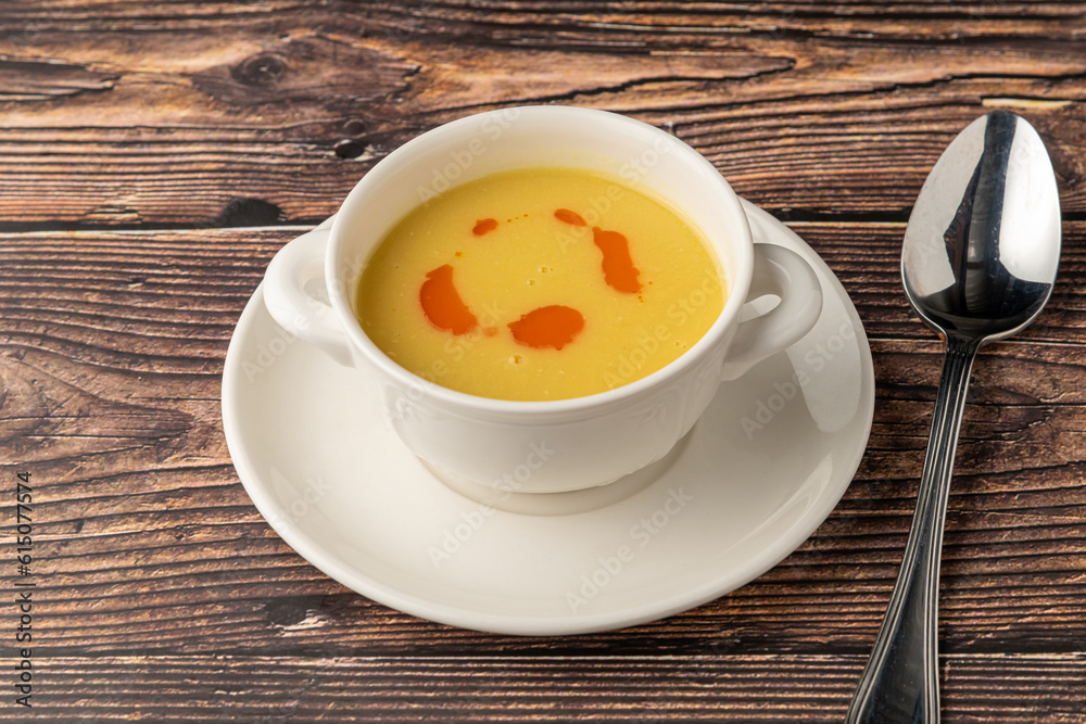 Strained lentil soup on a white porcelain plate Strained lentil soup on a white porcelain plate