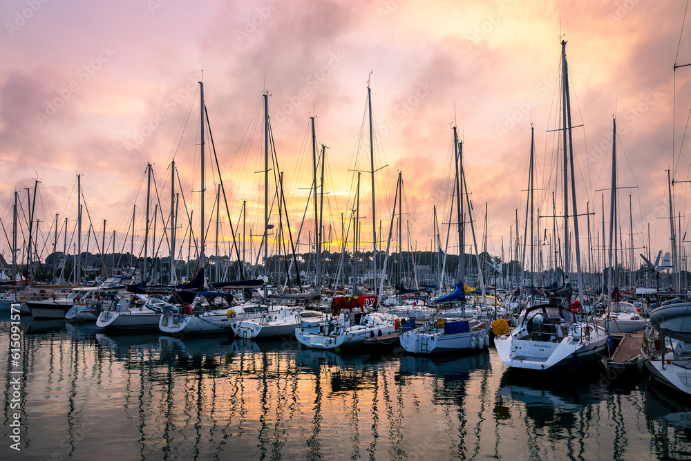 Sailing boats in the marina of La Trinité sur Mer at sunset, in Brittany, Morbihan, France