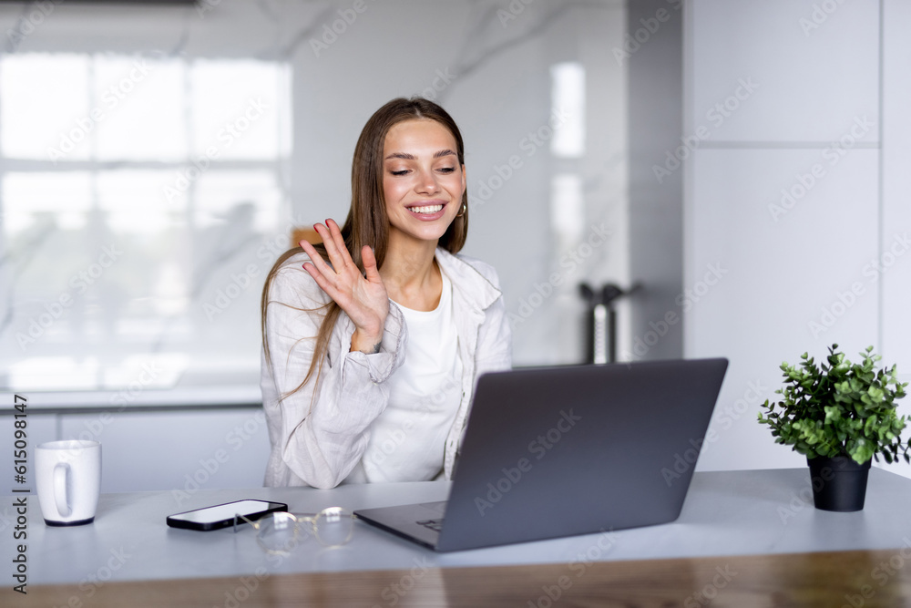 Young woman using white laptop and drinking coffee in kitchen. Online webinar, preparing for meeting. Young woman using white laptop and drinking coffee in kitchen. Online webinar, preparing for meeting.