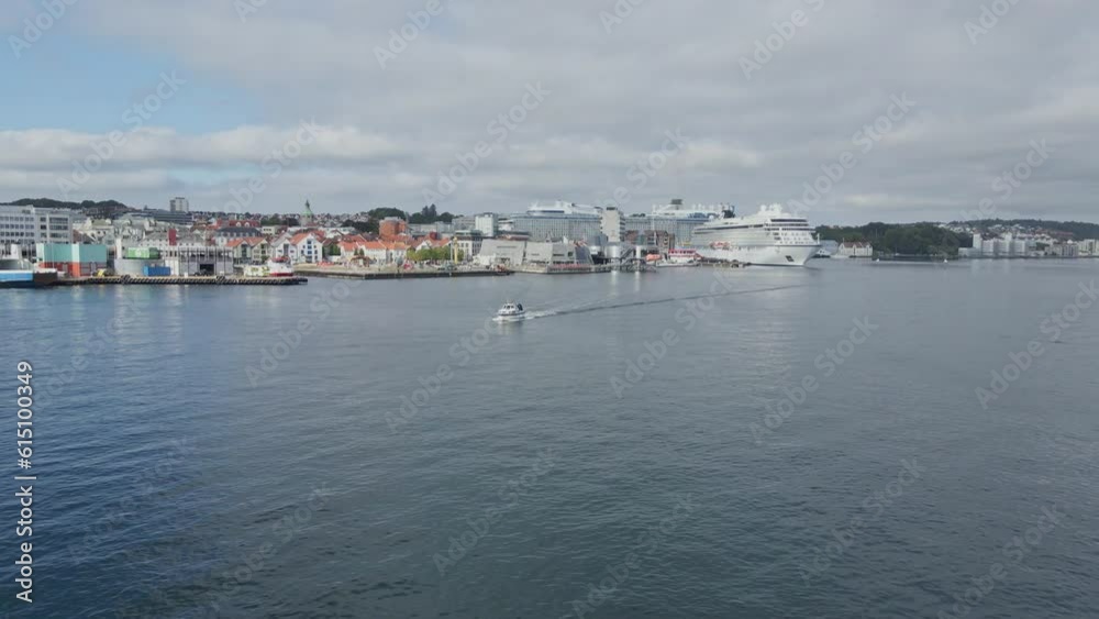 Flying over a boat's wake toward the port in Stavanger Norway Flying over a boat's wake toward the port in Stavanger Norway