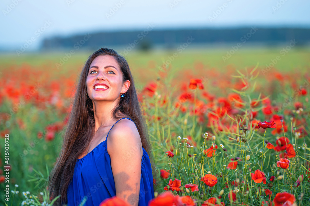 portrait of elegant young woman in poppy field in evening sunlight portrait of elegant young woman in poppy field in evening sunlight