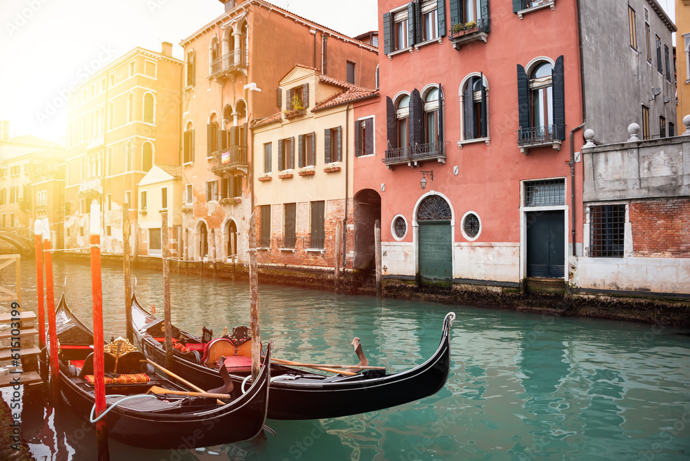 Narrow canal in Venice, Italy with gondolas