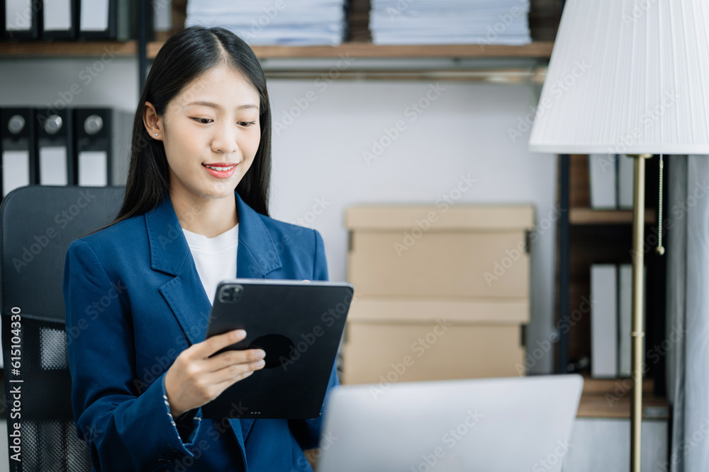 Send a message to a colleague, a businessman, confident in matching a tablet and sitting in office. Send a message to a colleague, a businessman, confident in matching a tablet and sitting in office.