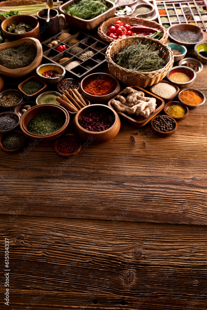Spices. Collection of spices in bowls on wooden rustic table forming an abstract background. Spices. Collection of spices in bowls on wooden rustic table forming an abstract background.
