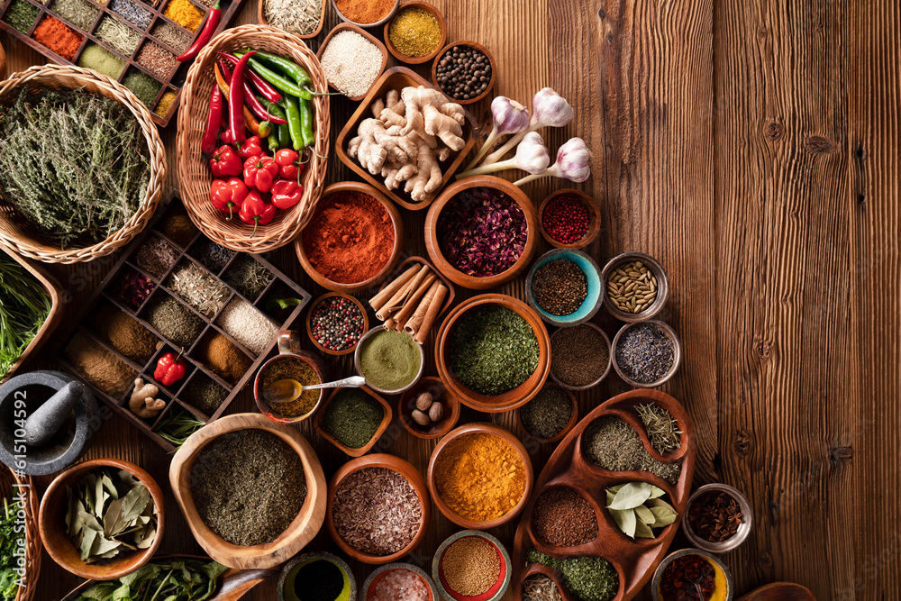 Spices. Collection of spices in bowls on wooden rustic table forming an abstract background. Spices. Collection of spices in bowls on wooden rustic table forming an abstract background.