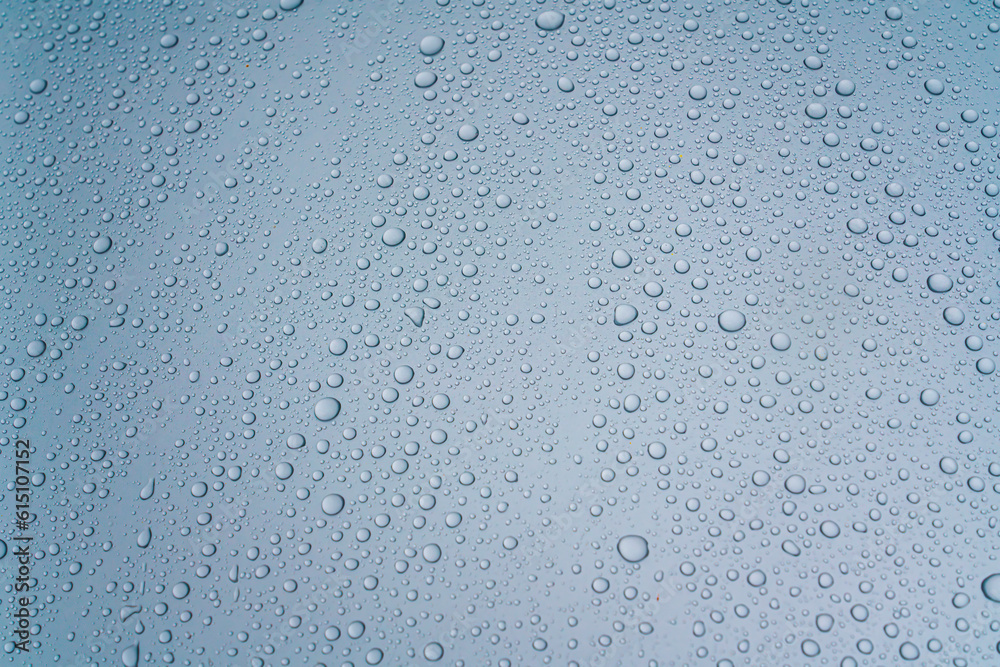 Background - water droplets on the surface of light blue color Background - water droplets on the surface of light blue color
