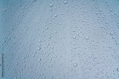 Background - water droplets on the surface of light blue color