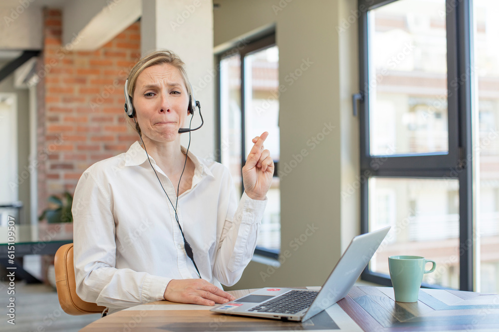 crossing fingers and hoping for good luck. telemarketer concept crossing fingers and hoping for good luck. telemarketer concept