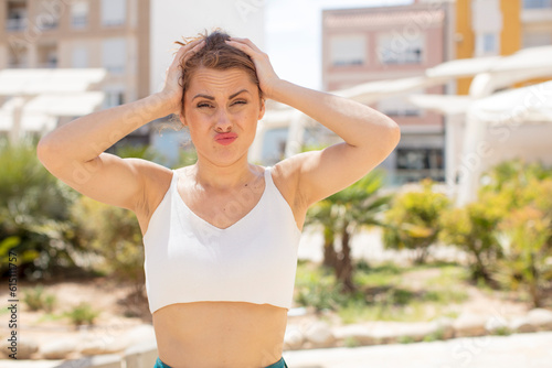 Free Download pretty young woman feeling stressed, worried, anxious or scared, with hands on head, panicking at mistake - GFXLoad