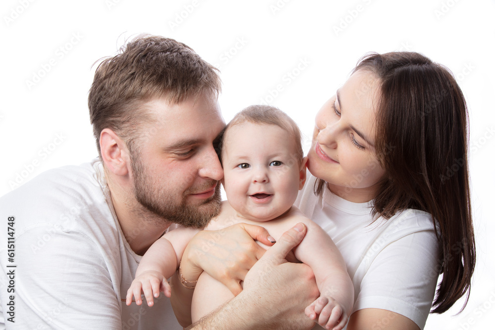 Close up portrait of young parents and baby. Father and mother kiss and hug a beautiful little son. The concept of love, happy fatherhood and motherhood. Close up portrait of young parents and baby. Father and mother kiss and hug a beautiful little son. The concept of love, happy fatherhood and motherhood.