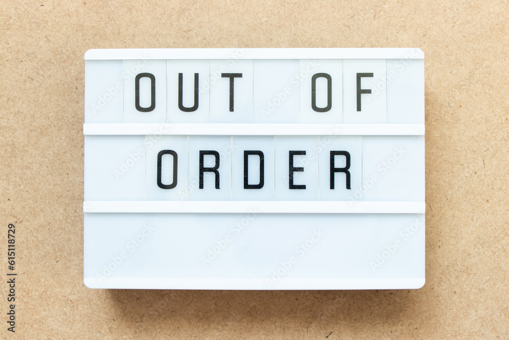Lightbox with word out of order on wood background Lightbox with word out of order on wood background