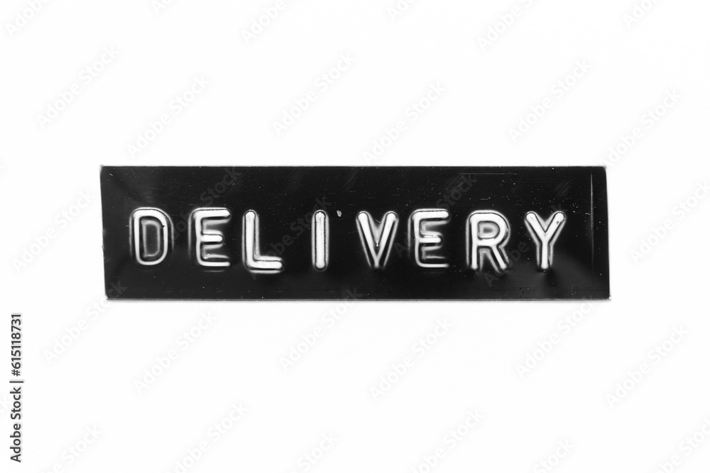 Black color banner that have embossed letter with word delivery on white paper background Black color banner that have embossed letter with word delivery on white paper background