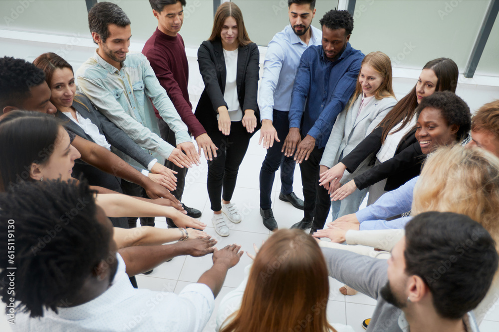 Narrow banner of multiracial people stack hands motivated for shared business success or goal achievement. Narrow banner of multiracial people stack hands motivated for shared business success or goal achievement.