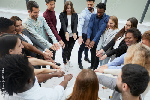 Narrow banner of multiracial people stack hands motivated for shared business success or goal achievement.