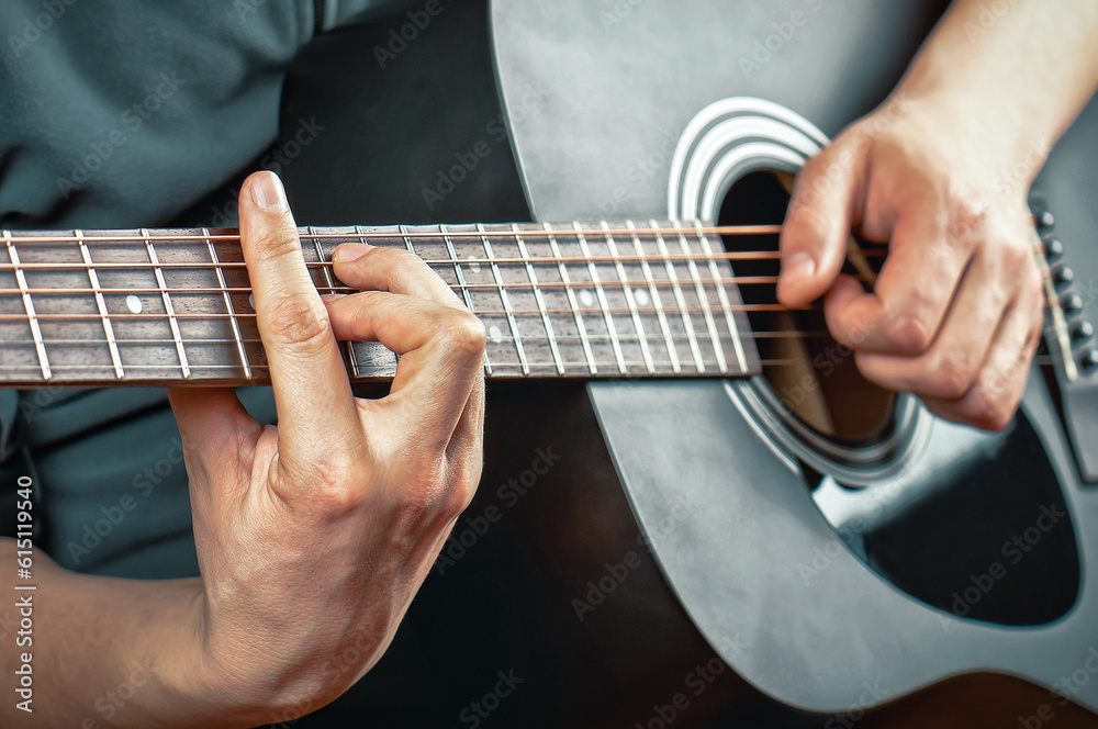 Man playing the acoustic guitar