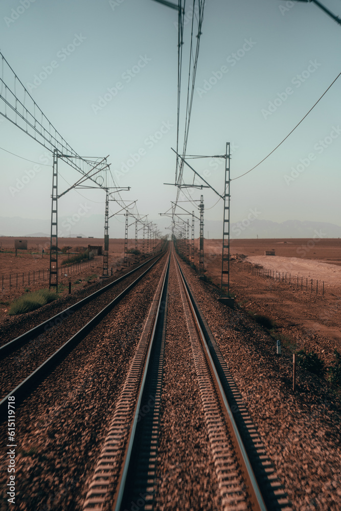 Train rails: Symbolic paths that stretch into the horizon, embodying adventure, anticipation, and limitless possibilities. Train rails: Symbolic paths that stretch into the horizon, embodying adventure, anticipation, and limitless possibilities.