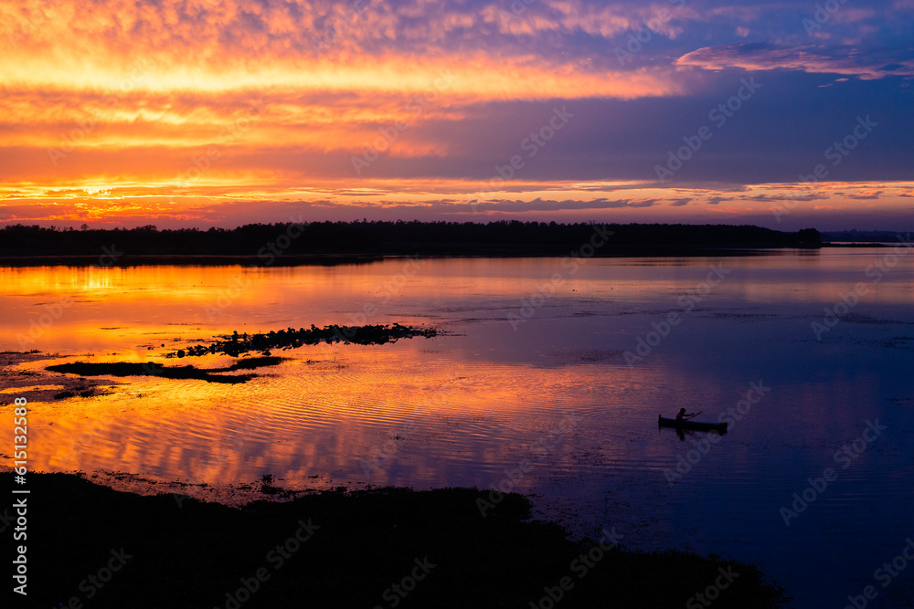 Sunset over water body