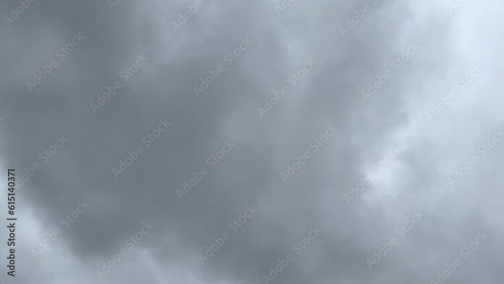 Gray gloomy storm clouds. Dramatic sky. lighting in the dark thunderstorm cloudiness. Time lapse of storm clouds during sunset. Terrible weather Gray gloomy storm clouds. Dramatic sky. lighting in the dark thunderstorm cloudiness. Time lapse of storm clouds during sunset. Terrible weather