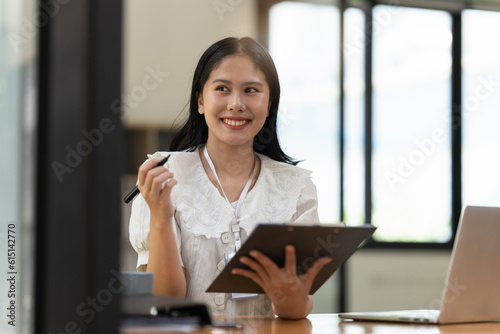 Free Download Financier a asian woman works, uses a laptop, makes a report to a finance company. Accounting and financial concept - GFXLoad
