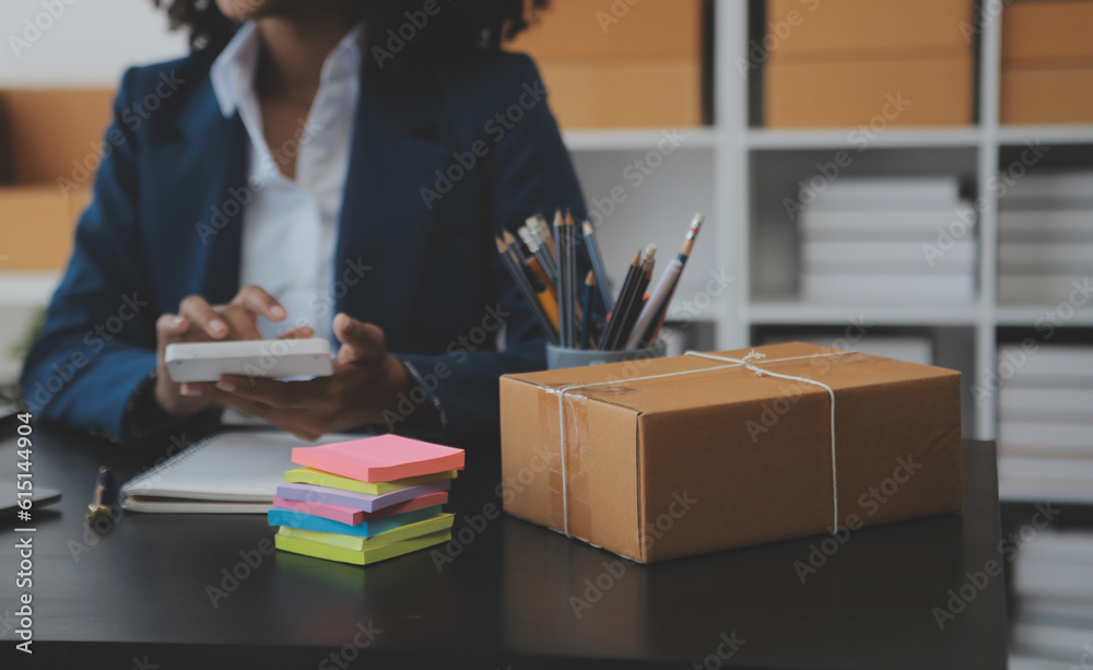 Business woman start up small business entrepreneur SME success .freelance woman working at home with Online Parcel delivery. SME and packaging deliveryconcept Business woman start up small business entrepreneur SME success .freelance woman working at home with Online Parcel delivery. SME and packaging deliveryconcept