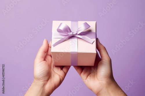 gift box with purple ribbon and bow in hands, christmas and holidays concept. AI generative
