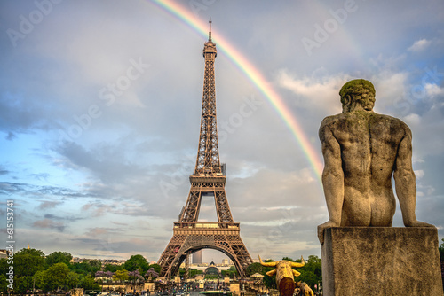 The Eiffel Tower after the rain fall with a beautiful rainbow ,on the evening