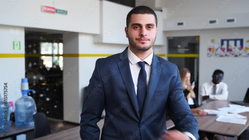 Smiling arab businesman in formal outfit looking at camera standing in office. Portrait of happy handsome multiethnic man wearing suit, bow tie. Confident corporate worker posing. Smiling arab businesman in formal outfit looking at camera standing in office. Portrait of happy handsome multiethnic man wearing suit, bow tie. Confident corporate worker posing.
