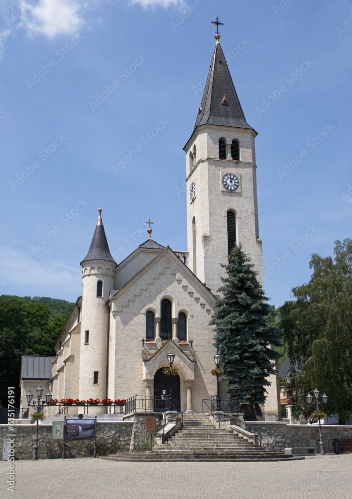 Tokaj, Hungary - Jun 20, 2023: A walking in the center of Tokaj city in northeastern Hungary in a sunny spring day. Heart of Jesus Church. Selective focus