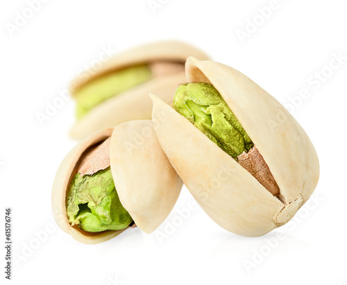 three pistachios on a white isolated background