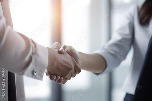 business people shaking hands in office, Sealing the Deal: A Captivating Close-Up of a Handshake between a Man and Woman in a Business Situation