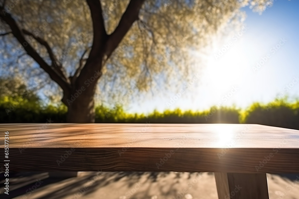Nature's Canvas: Close-Up of an Empty Wooden Table, Bathed in Sunlight and Embraced by the Tranquil Ambiance of a Green Meadow and Unsharp Blue Sky