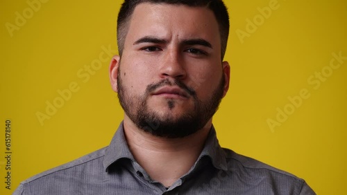 4k video of one man who posing over yellow background.