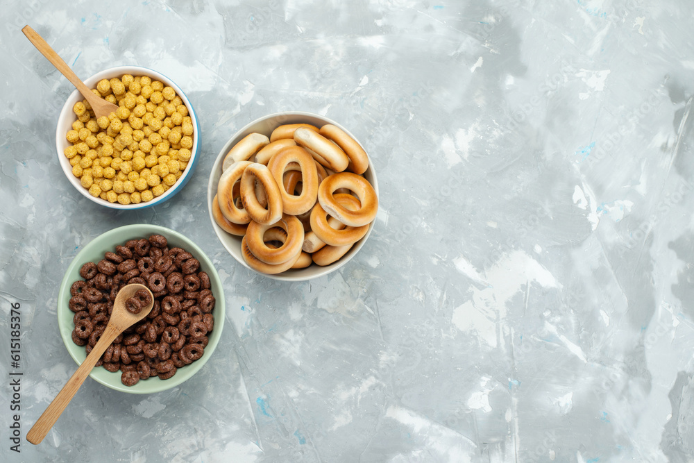top view cereals and crackers inside plates on the blue background cracker crisp cereal breakfast top view cereals and crackers inside plates on the blue background cracker crisp cereal breakfast