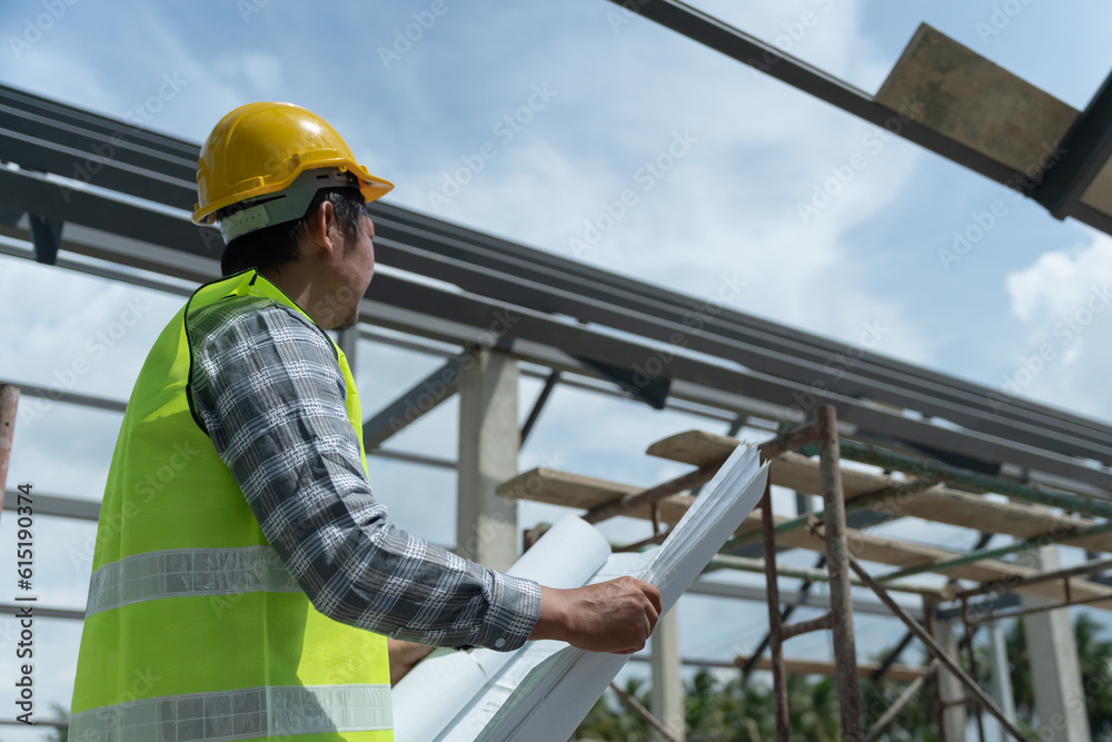 inspector or engineer is inspecting construction and quality assurance new house using a blue print. Engineer or architects or contactor work to build the house before handing it over to the homeowner inspector or engineer is inspecting construction and quality assurance new house using a blue print. Engineer or architects or contactor work to build the house before handing it over to the homeowner