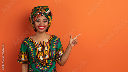 Pretty african woman showing copy space for advertisement