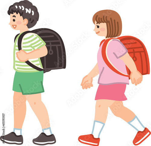 ランドセルを背負って歩く小学生の男女　登校　通学