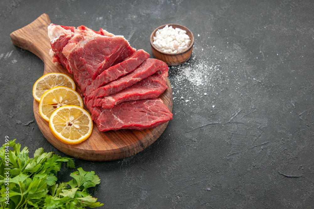 front view fresh sliced meat sliced with lemon slices on a dark background dinner food barbecue butcher meal animal color meat