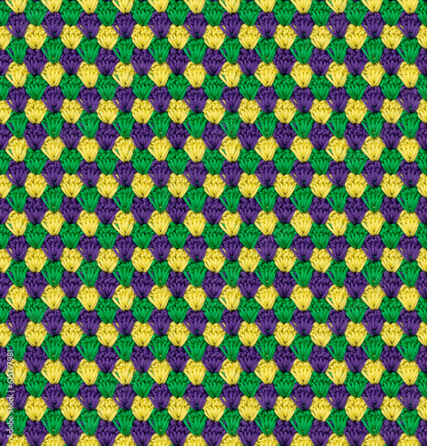 Seamless knitted texture in the form of flower buds. The pattern is crocheted from multicolored cotton yarn. Bright summer range of shades.