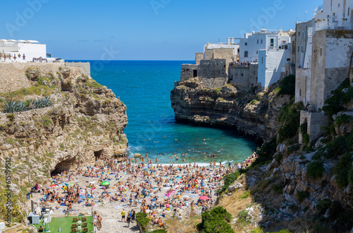 POLIGNANO A MARE, ITALY, JULY 11, 2022 - View of the beach of Polignano a Mare, province of Bari, Puglia, Italy