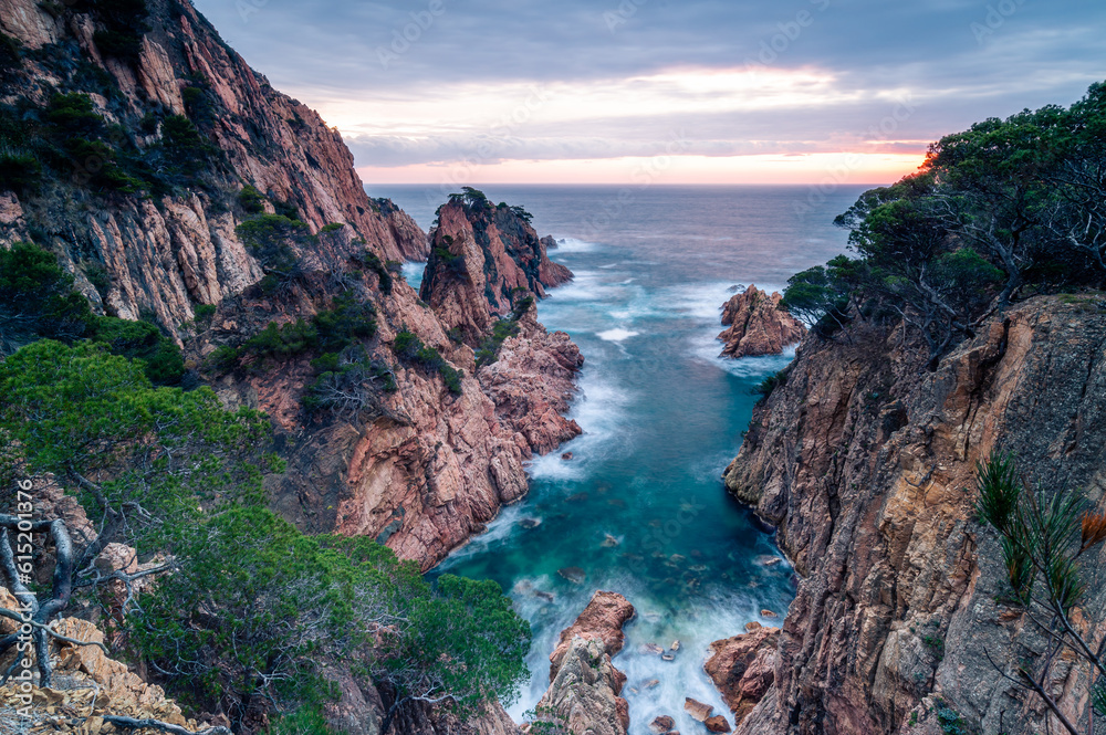 Sunrise at the rocky coastline of the sea Sunrise at the rocky coastline of the sea