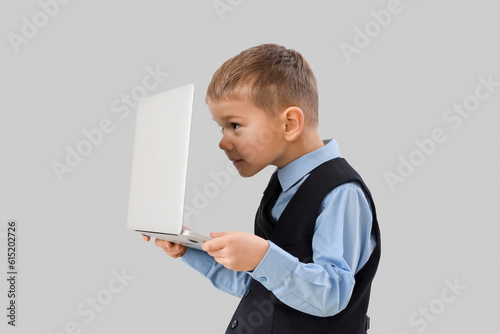 Cute little businessman wit...